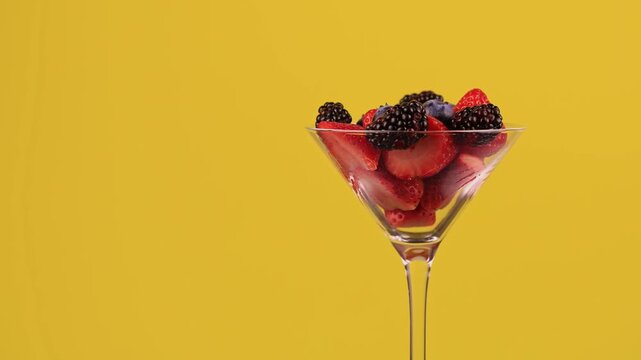 Strawberries Blackberries And Blueberries In A Cup Rotating