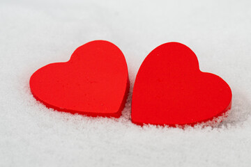 Fototapeta premium red hearts on the snow=