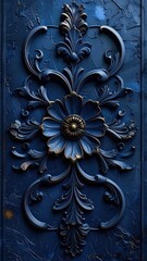 Intricate deep blue baroque metalwork featuring a central stylized flower.