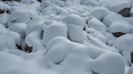 Obraz premium Snow covered rocks in serene winter landscape