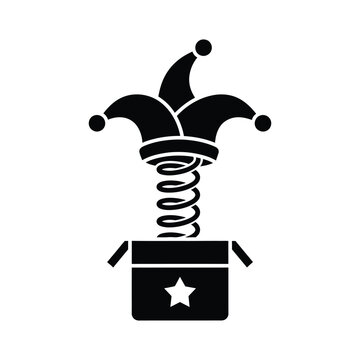 Black and white jester's hat popping out of a jack in the box