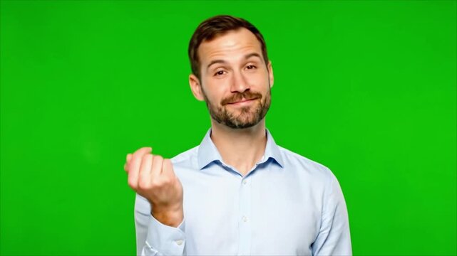 Confident man in light blue shirt gesturing middle finger and beckoning on green screen background