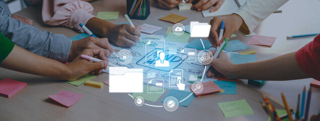 A dynamic teamwork scene showcasing diverse hands engaged in planning and brainstorming with sticky...