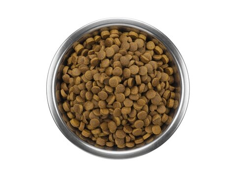 A stainless steel bowl filled with round, brown dry pet food kibble, viewed from directly above on a white background.