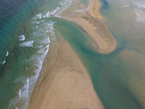 Aerial top view of the golden sands of the Peninsula and the lagoon in Jandia, with turquoise waters at sunset, Jand&Atilde;&shy;a Natural Park, Fuerteventura, Canary Islands, Spain.