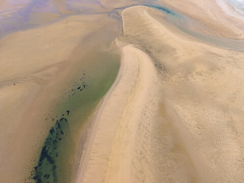 Aerial view of golden sands meeting the turquoise waters in the Jand&Atilde;&shy;a Natural Park, Fuerteventura, Canary Islands, Spain.