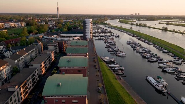 Aerial view of dutch city of Roermond, marina and a river Meuse by sunset