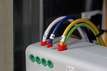 Marking electrical wiring wires with thermally printed nylon tape. 