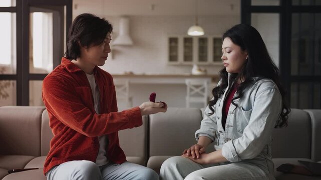 Asian woman rejecting boyfriend's proposal at home, emotional stress, breakup
