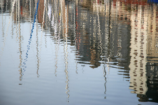 Refelctions in still water of the old harbour, Honfleur, Normandy, France