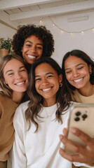 Happy friends taking a selfie indoors