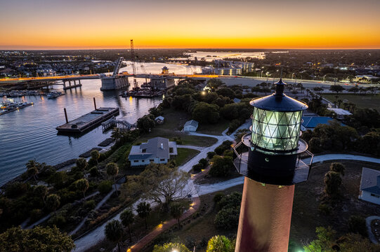 Aerial view of the Jupiter Inlet Lighthouse casting a long shadow over the park at sunset, Jupiter, Florida, United States.