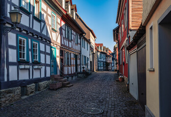 Fototapeta premium Narrow, romantic alleyways with cobblestones and half-timbered houses in Idstein in the Taunus region