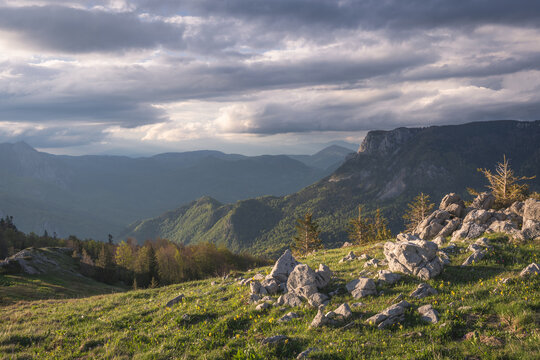 Aerial view of rolling green hills speckled with rocky outcrops under a dramatic sky, Tjenti&Aring;&iexcl;te, Republika Srpska, Bosnia and Herzegovina.