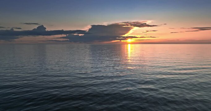 Calm golden sunset over Batlic sea in summer.