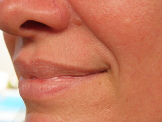 Obraz premium Closeup of a smiling woman face. Woman in her forties face.