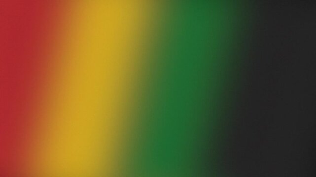 Abstract gradient background with blurred red, yellow, and green colors creating a fading pattern. Smooth color transition as digital graphic element.