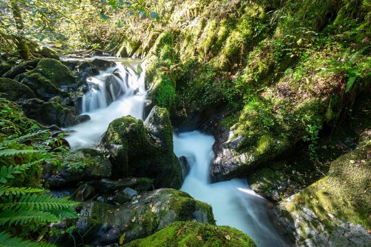 Long exposure of a waterfall on the Hoar Oak Water river at Watersmeet in Exmoor National Park