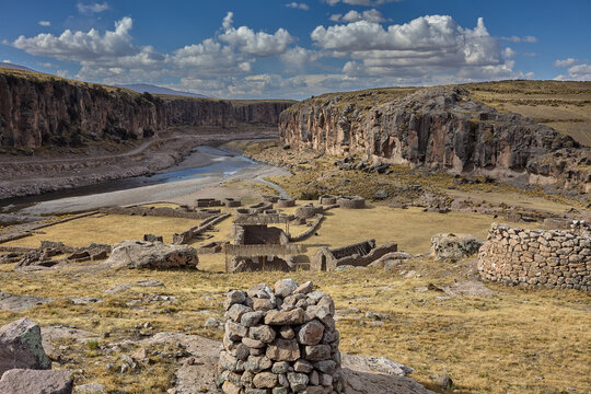 Maukallaqta archaeological complex which feature distinctive domed stone structures and cylindrical towers. Located in the Coporaque district of Espinar, this site is renowned for its well-preserved 