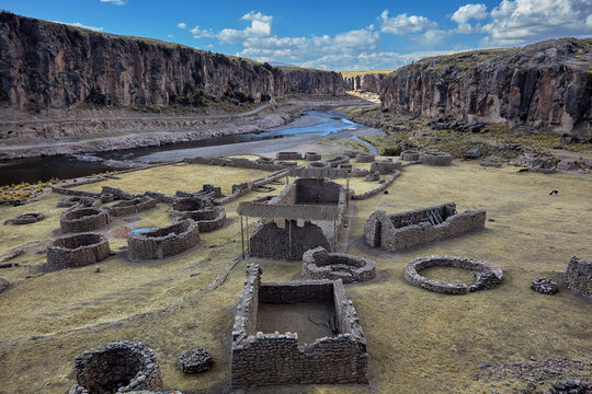 Maukallaqta archaeological complex which feature distinctive domed stone structures and cylindrical towers. Located in the Coporaque district of Espinar, this site is renowned for its well-preserved 