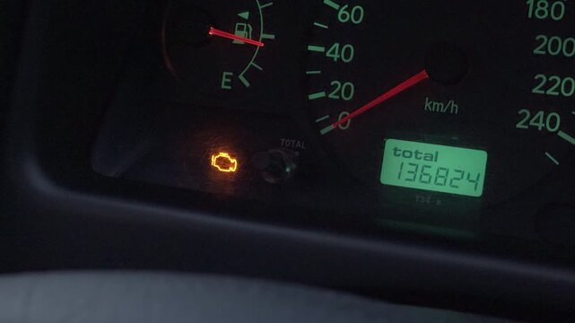 Bright amber indicator light signals immediate attention required for vehicle servicing or roadside assistance