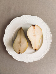 Pear on a plate. Still life aesthetic