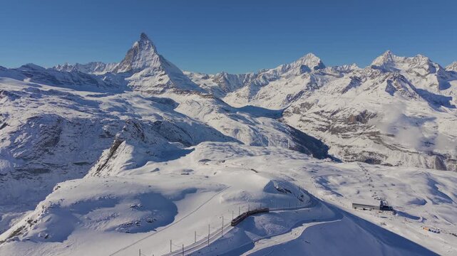 Matterhorn in Motion: Aerial Winter Escape, Gornergrat Tracks to the Summit of Beauty