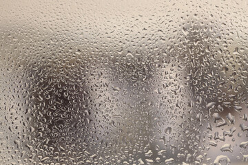 Soft focus wet water Drops through glass. Abstract natural blur gradient background.