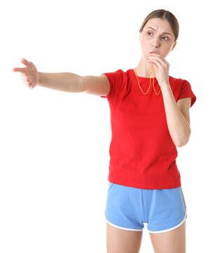 Professional referee blowing whistle on white background