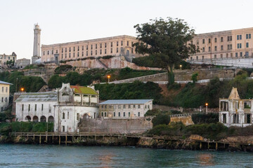 Alcatraz prison at sunset, showcasing the historic island fortress with dramatic evening lighting. Iconic landmark in San Francisco Bay, representing history, tourism, and a mysterious atmosphere