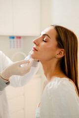 Improved face shape with chin and jawline contouring in aesthetic treatment.