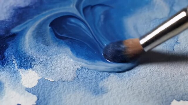 Abstract watercolor painting with shades of blue, creating a serene artistic background.