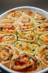 Stuffed savory rolls with ham, cheese and caramelizedo onion  