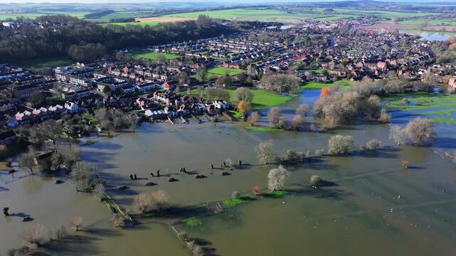 Aerial shot of flooded fields and houses in Salisbury, UK,  following Storm Chandra