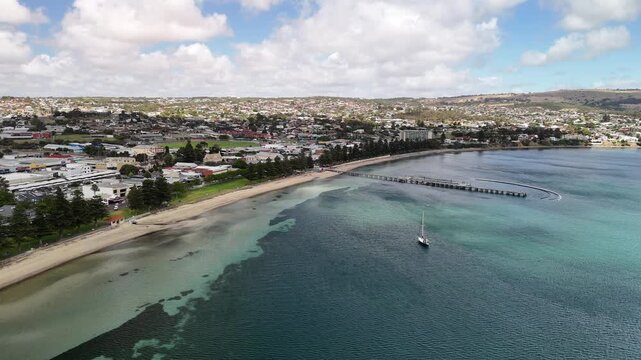 Port Lincoln, South Australia &ndash; 4K aerial drone view of coastal city, jetty, turquoise bay, beachfront, marina, suburban houses, residential estates and Eyre Peninsula shoreline