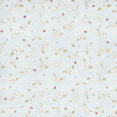 Fototapeta premium Soft blue seamless floral scroll pattern with pastel flowers and subtle texture. Elegant vintage background ideal for textiles, wallpaper, stationery, and classic decor.