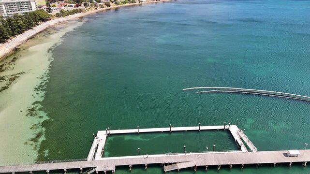 Port Lincoln, South Australia &ndash; 4K aerial drone view of coastal city, jetty, turquoise bay, beachfront, marina, suburban houses, residential estates and Eyre Peninsula shoreline