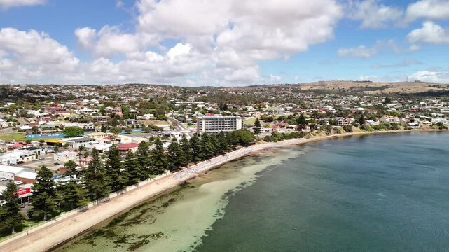 Port Lincoln, South Australia &ndash; 4K aerial drone view of coastal city, jetty, turquoise bay, beachfront, marina, suburban houses, residential estates and Eyre Peninsula shoreline