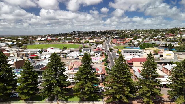 Port Lincoln, South Australia &ndash; 4K aerial drone view of coastal city, jetty, turquoise bay, beachfront, marina, suburban houses, residential estates and Eyre Peninsula shoreline
