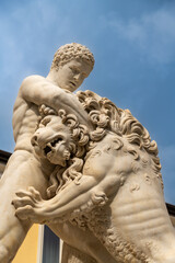 Fototapeta premium Marble statue of Hercules wrestling lion sculpture