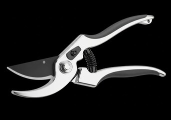 Pruning shears with black handles on a black background for gardening and landscaping purposes