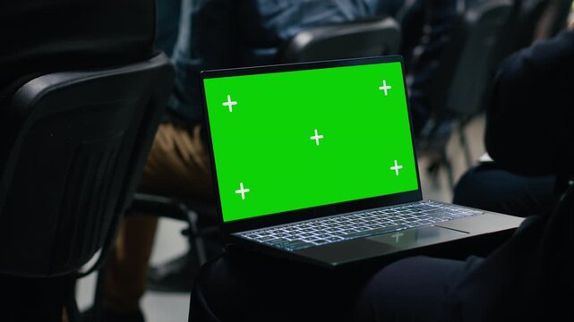 Isolated mockup screen at business conference meeting with panel and guest speaker. Multiethnic audience of professionals listen to presentation focused on leadership and development. Camera B.