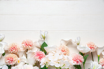 Different blossoming branches on white wooden background