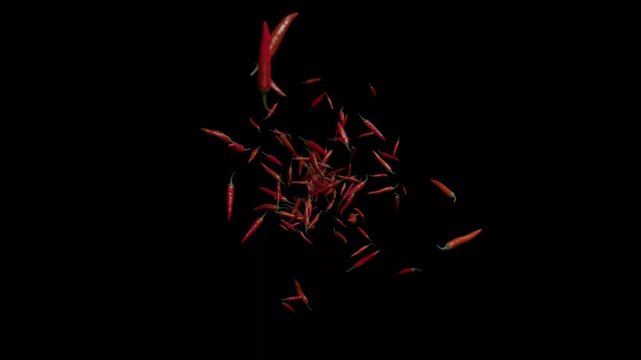 A cinematic slow-motion explosion of vibrant red chili peppers bursting from the center toward the camera. Featuring a shallow depth of field and professional "die-cut" alpha channel (transparent back