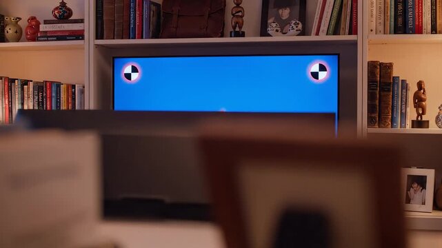 Television screen displaying test pattern in living room