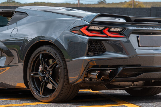 Grey Chevrolet Corvette C8 rear quarter view, Luxury sportscar parked on asphalt