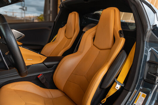 Grey Chevrolet Corvette C8 tan leather seats closeup, Luxury sportscar interior detail