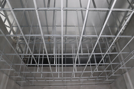 Dense ceiling grid structure highlighting modern construction techniques and structural alignment
