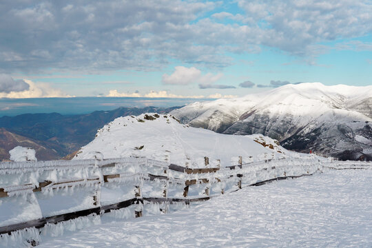 Snowy mountain landscape at Valgrande-Pajares ski resort in northern Spain, close view of snow-covered peaks and panoramic views from the top of the mountain