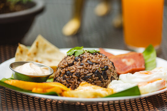 Gallo pinto breakfast plate with fried eggs and plantains